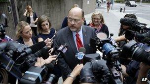 Republican mayoral hopeful Joe Lhota talks with reporters as he arrives to his polling station during the primary election in New York, 10 September 2013