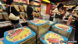 Shoppers inspect boxes of "mooncakes"