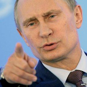 Russia's President Vladimir Putin gestures during a press conference at the end of the G20 summit in Saint Petersburg, Russia, on 6 September 2013