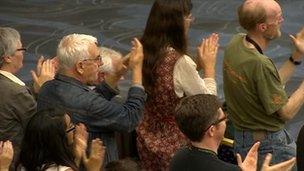 green supporters applauding