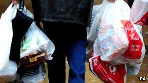 Man carrying plastic bags