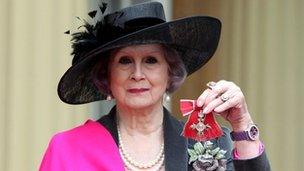 April Ashley with her MBE medal