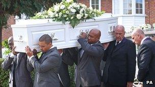 The body of Sabrina Moss is carried into St Alphage Church in Burnt Oak, north London