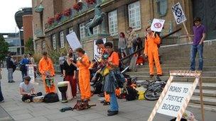 People taking part in a UK Uncut demonstration