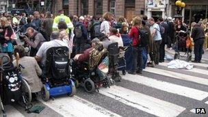 Demonstrators stage a roadblock outside the Royal Courts of Justice