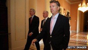 Senator Rand Paul walks to a meeting in the US Capitol.