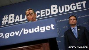 Congressman Luke Messer stands behind House Speaker John Boehner on Capitol Hill on 10 April 2013