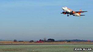 Easyjet plane taking off from Inverness Airport