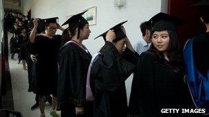 Chinese students lining up to receive degree certificates