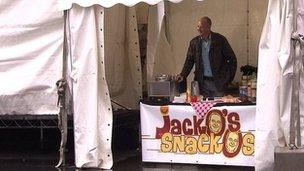 Chris Jackson running his fake food stall - Jacko's Snackos