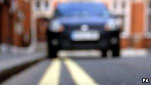 car parked on double yellow lines