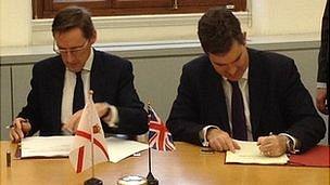 Jersey's Chief Minister Senator Ian Gorst and the Exchequer Secretary to the Treasury David Gauke sign a tax exchange deal