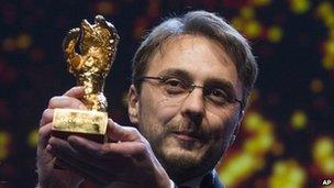 Director Calin Peter Netzer picks up the Golden Bear prize at the Berlin film festival on 16/2/13