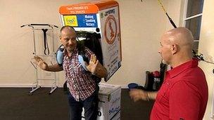 Chris Jackson tries 'The Fridge' on for size under the guidance of charity runner Tony Morrison