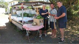 Wayne Allum (centre) and two customers