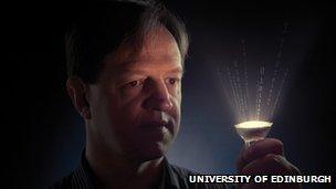 Prof Harald Haas holding LED bulb