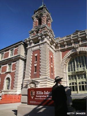 A National Park Service ranger stands near the Ellis Island Immigration Museum after it was re-opened to the public on October 28, 2013 in New York City