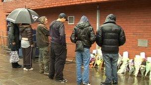 Family hold vigil outside police station