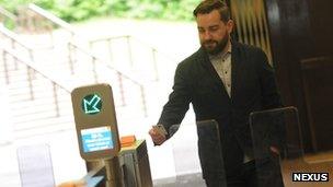 Man using automatic ticket gates