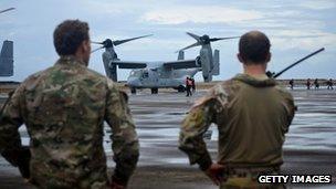 Unidentified soldiers stand near a V-22 Osprey in Leyte, Philippines on 12 November 2013