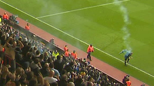 Linesman is struck by smoke canister