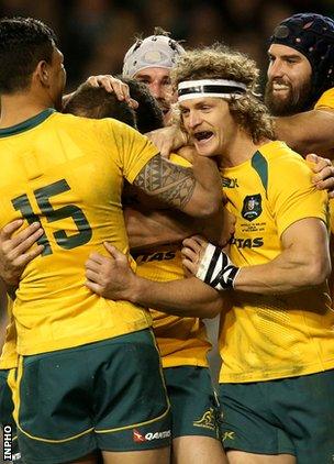 Australian celebrates after Quade Cooper scored their third try against Ireland