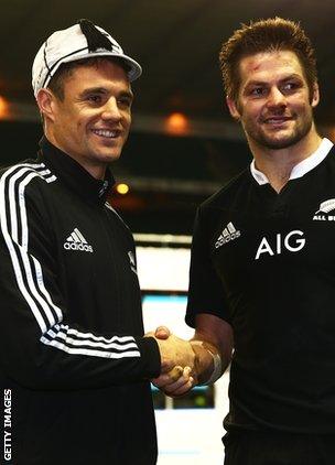 Fly-half Dan Carter receives his 100th cap from captain Richie McCaw