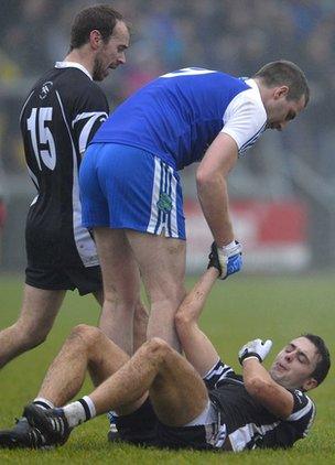 James Conway of Ballinderry has a word with grounded Kilcoo man Ryan Johnston