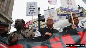 General Secretary Bob Crow (C) and TSSA General Secretary Manuel Cortes (R) join campaign groups protesting outside Oxford Circus tube station against plans to reduce staff on transport routes across the Capital on October 23