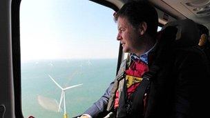 Nick Clegg looks at a wind farm off the Lincolnshire coast.