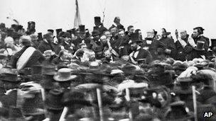 President Abraham Lincoln surrounded by the crowd at the dedication of a portion of the battlefield at Gettysburg as a national cemetery in 1863