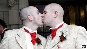 Two men kiss on the day of their civil partnership ceremony