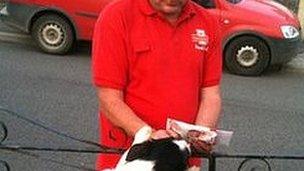 A postman on his round in Wales