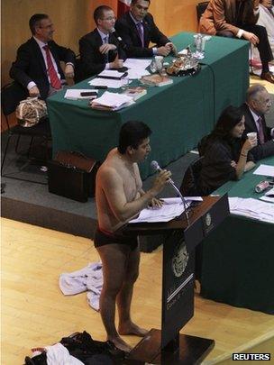 Opposition MP Antonio Garcia strips down to his underwear in Congress