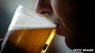 Man drinking pint of beer