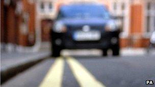 Car parked on double yellow lines