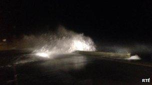 Wave hits the promenade in Salthill, County Galway