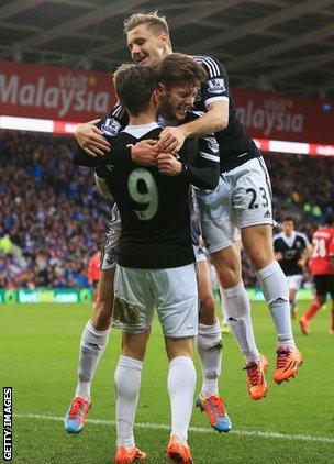 Luke Shaw, Adam Lallana and Jay Rodriguez celebrate a goal against Cardiff.