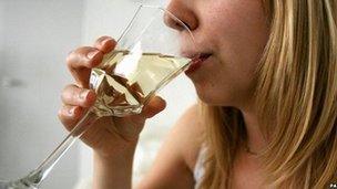 Woman drinking a glass of wine