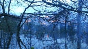 The barn on fire in Twyford was surrounded by floodwater