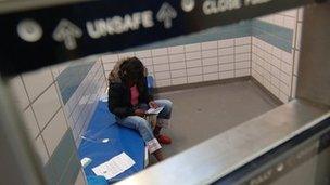 A youngster held in a prison cell