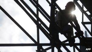 Construction worker on scaffold