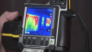 Infrared camera displaying heat loss on the exterior of a house