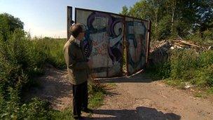 Man standing at an entrance to the former colliery site