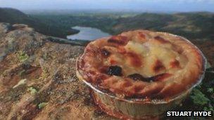 Pie on crag overlooking Lake District