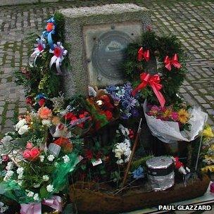 Fishermen's memorial covered in wreaths