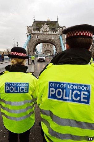 Police walking across Tower Bridge