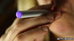 Woman smoking an electronic cigarette