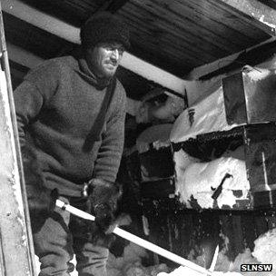 Xavier Mertz clears snow at base camp