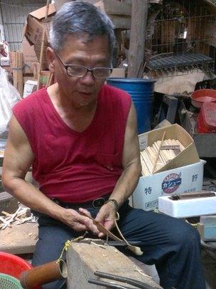 A worker at Mr Lin's factory